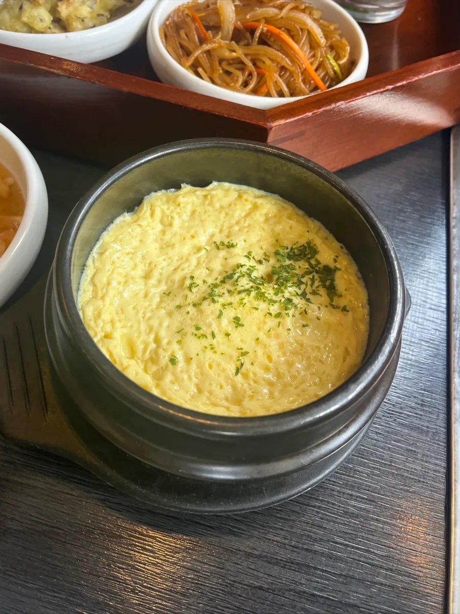 Soft steamed egg ordered as a side