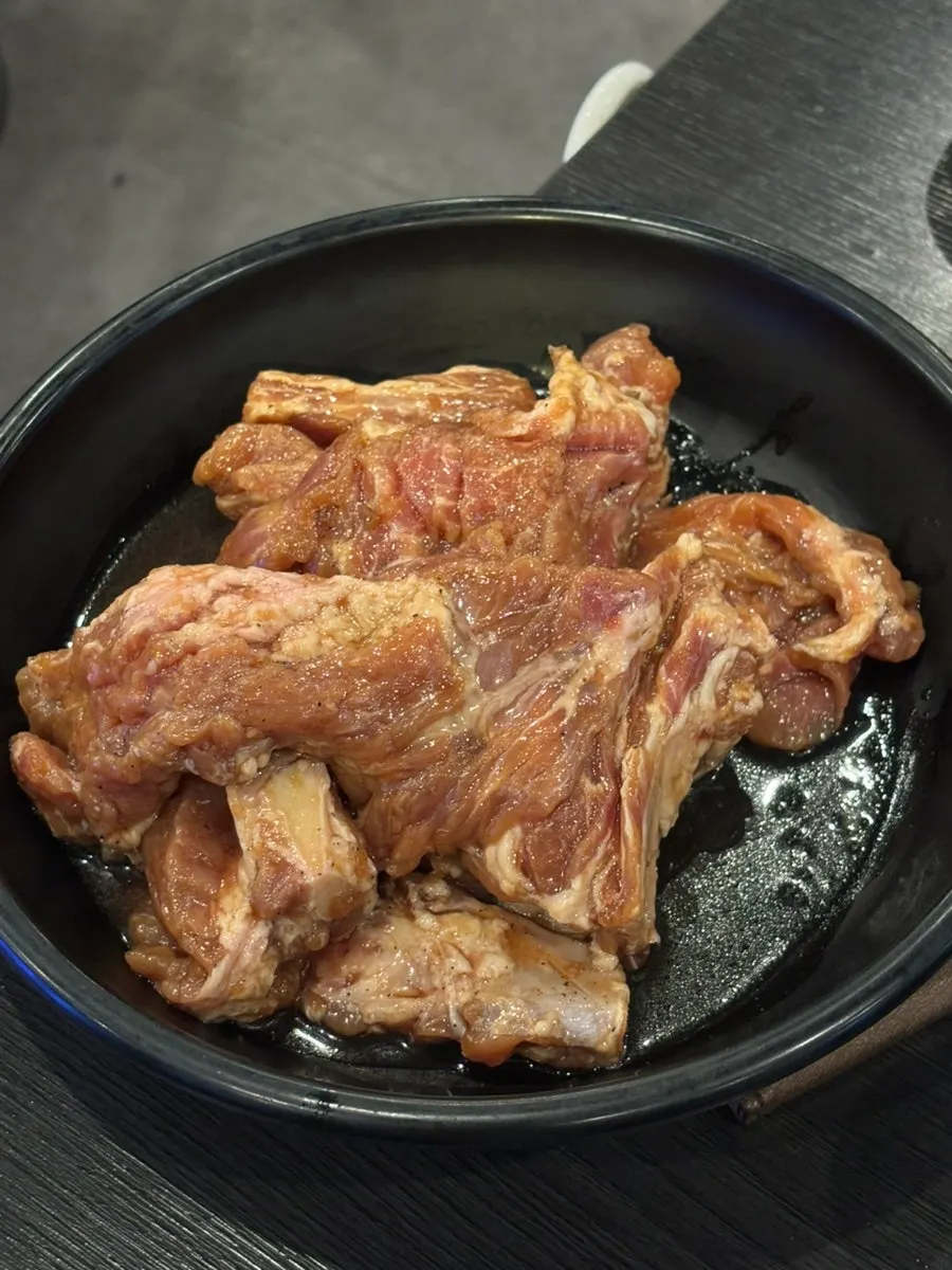 Marinated pork galbi placed on the grill