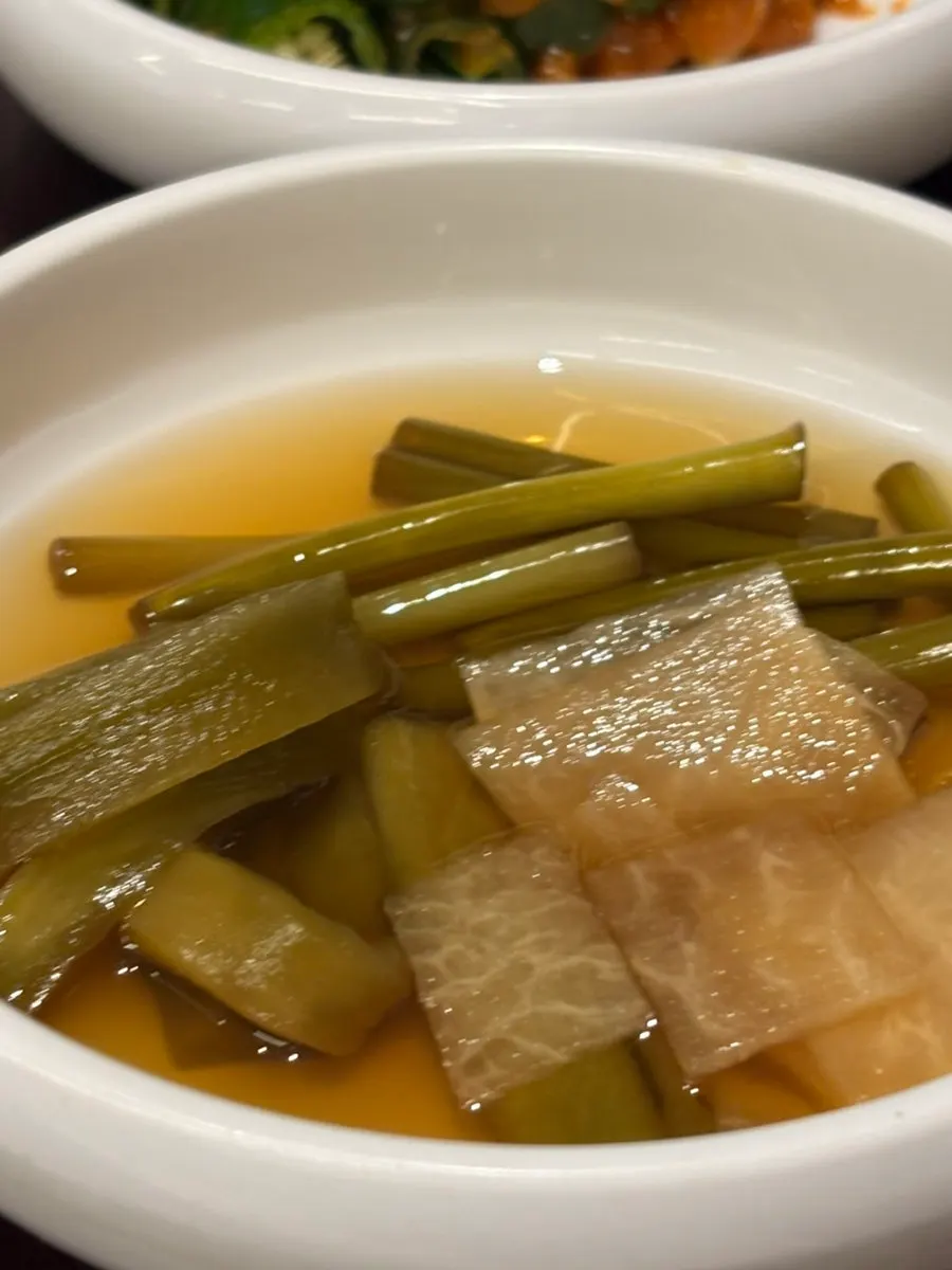 Plate with sliced onion and side dishes
