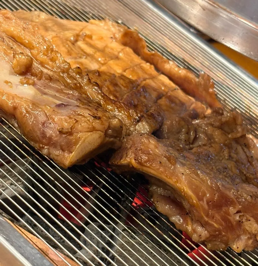 Marinated galbi grilled golden brown and cut into pieces