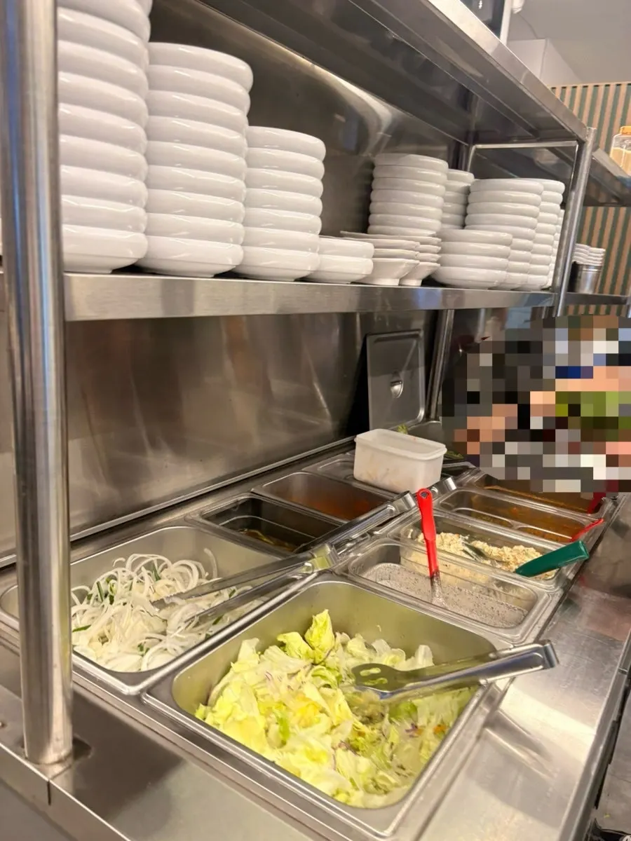 Extra shredded scallion and vegetables from the self-serve bar