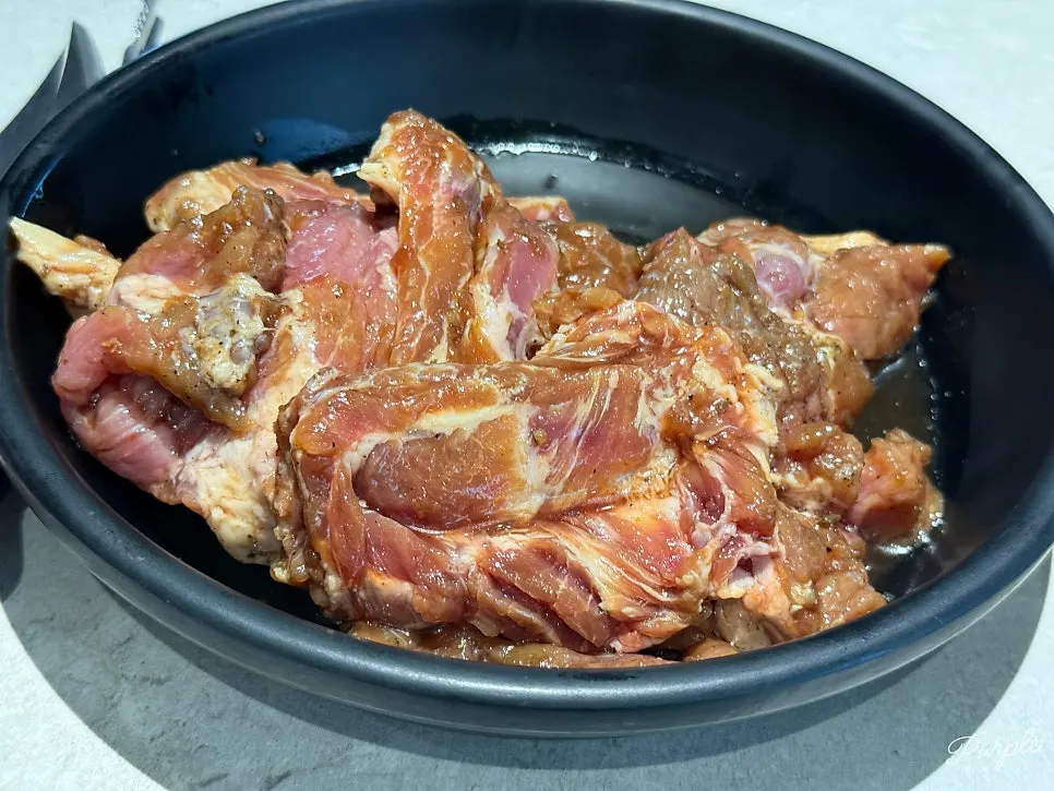 Plate of 3 servings of handmade Korean pork galbi at Manpo Garden