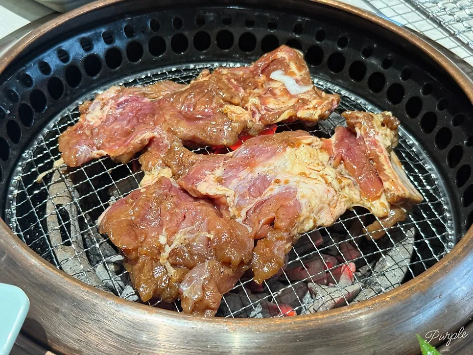 Marinated pork galbi placed on the charcoal grill