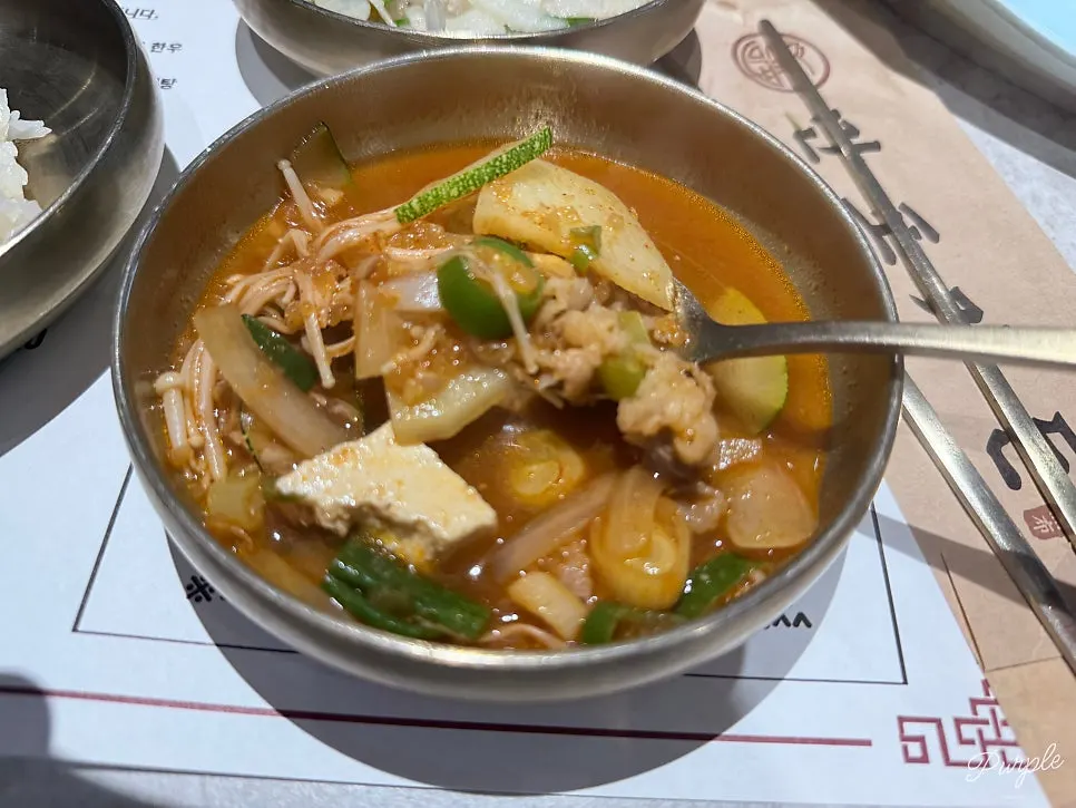 Doenjang stew served alongside a bowl of rice
