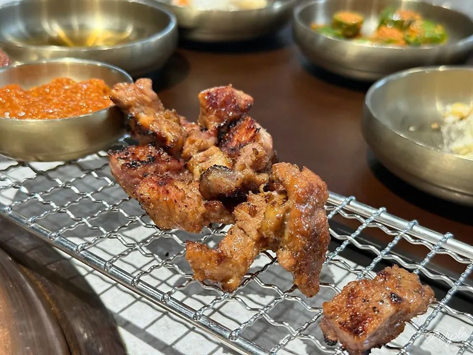 Table full of galbi and side dishes at Manpo Garden