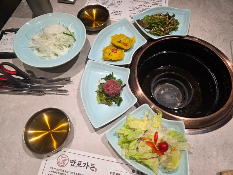 Manpo Garden's menu board