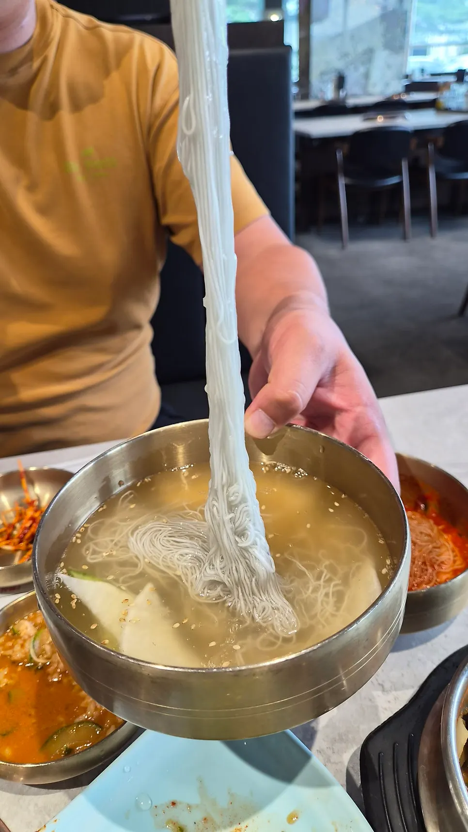 Free handmade water naengmyeon served in brassware