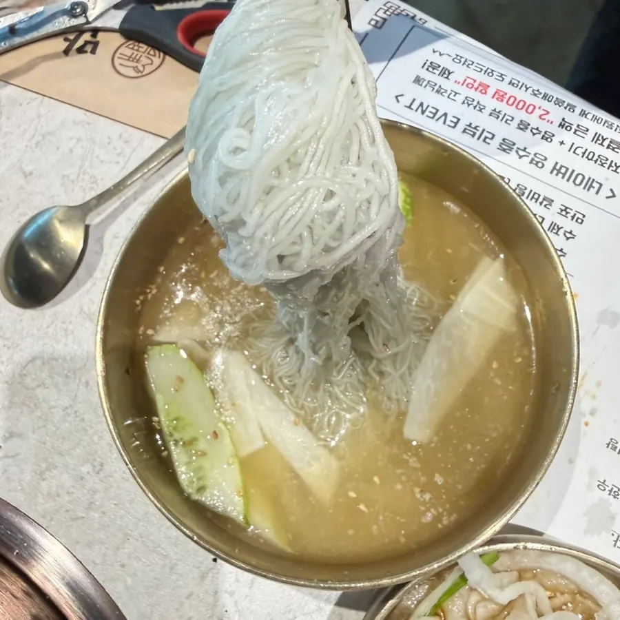 Handmade spicy mixed naengmyeon tossed with seasoning