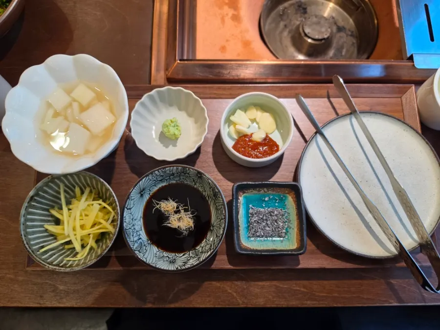 Table setting with a pot of warm tea