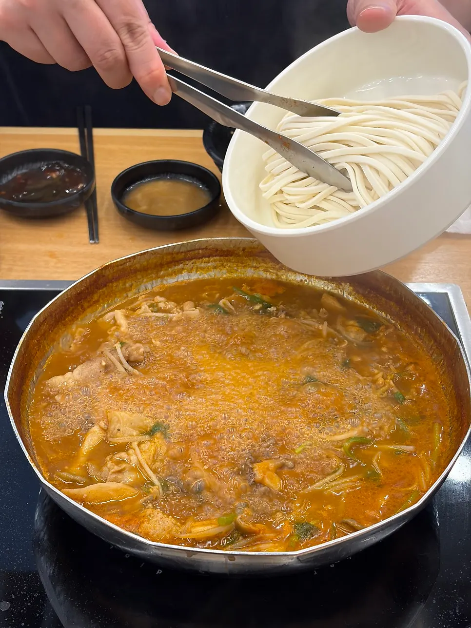 Pork shabu-shabu cooked in the spicy broth
