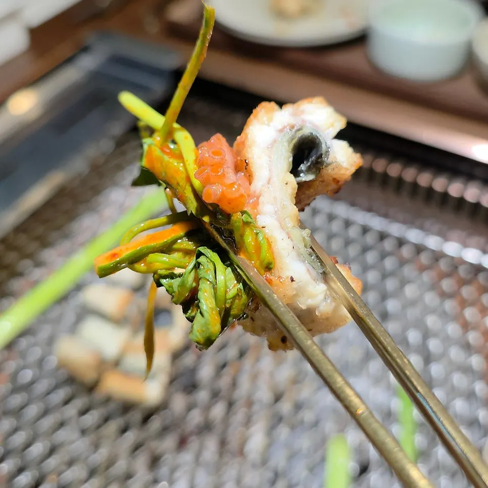 Table with salt-grilled eel and side dishes