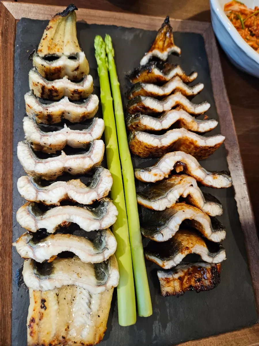 Pre-grilled eel with a glossy coat of seasoning