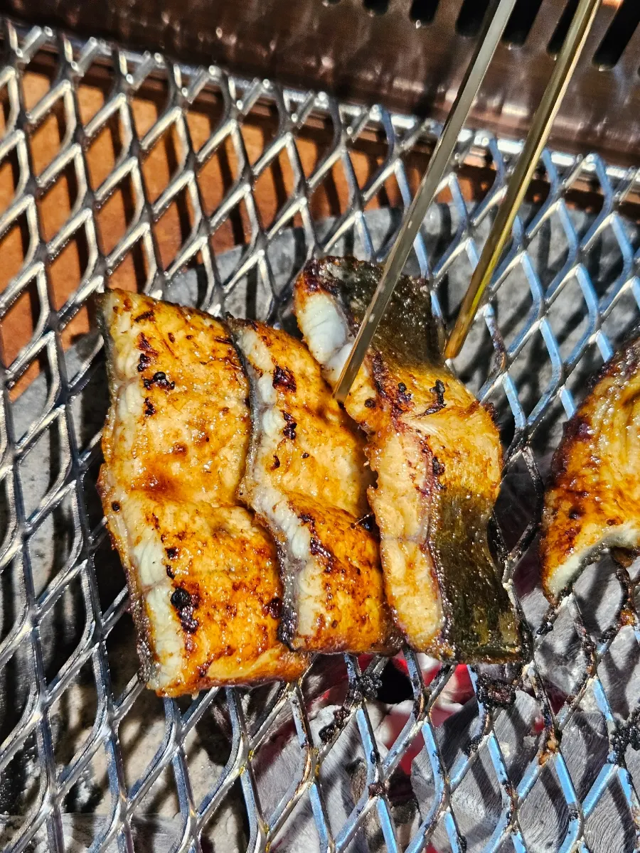 Eel finished on the tabletop charcoal grill