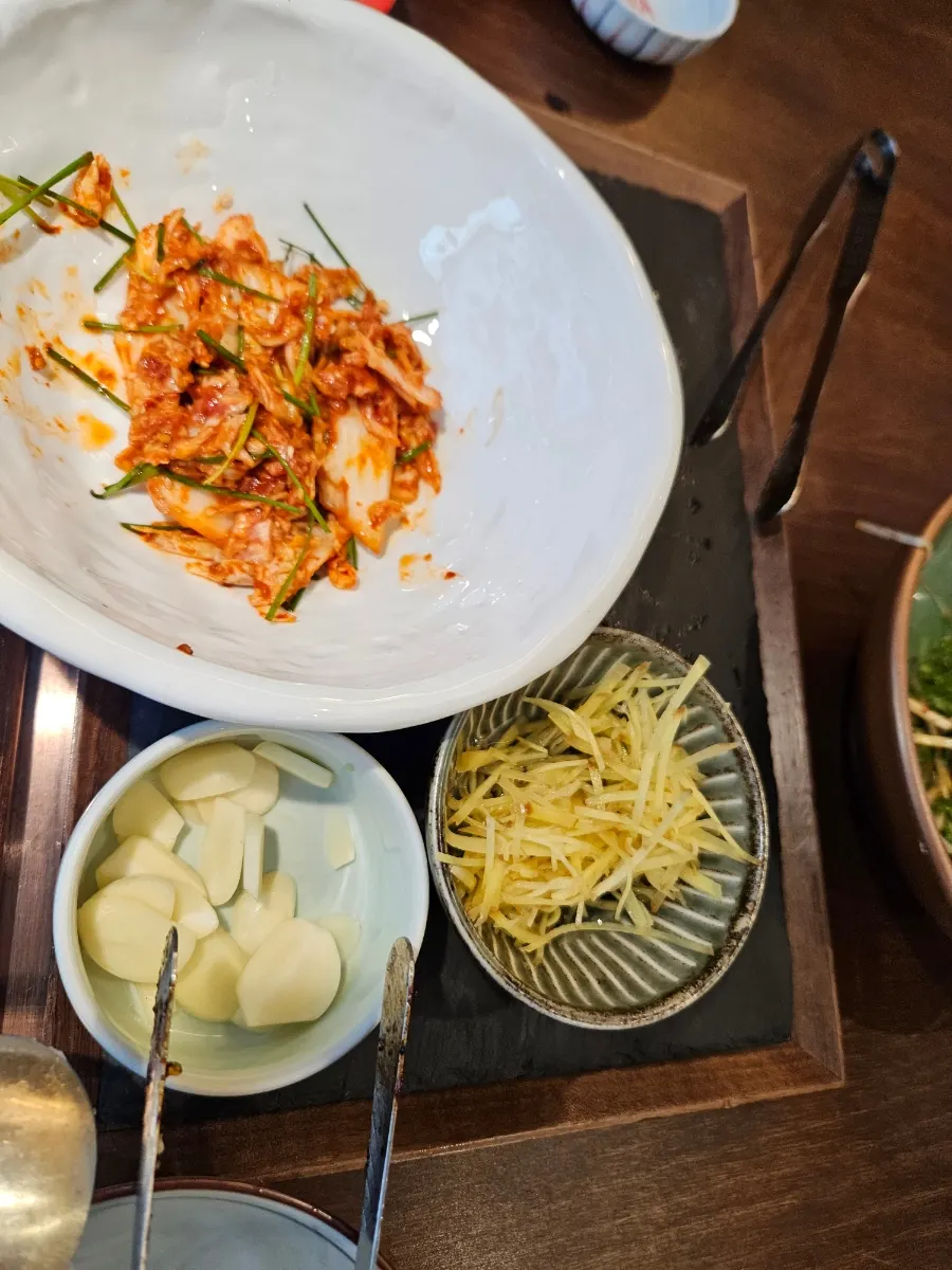 Ginger and sauce served alongside the eel