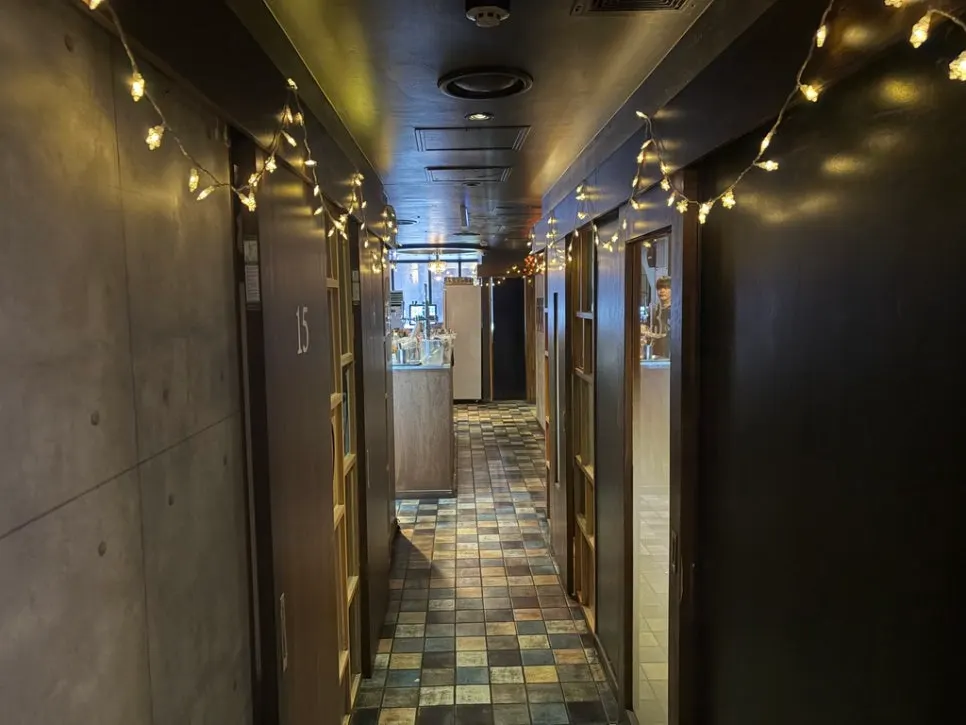Hallway inside the restaurant lined with rooms