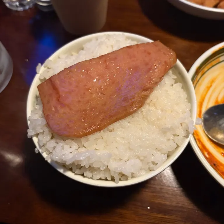 Bowl of rice topped with a slice of spam