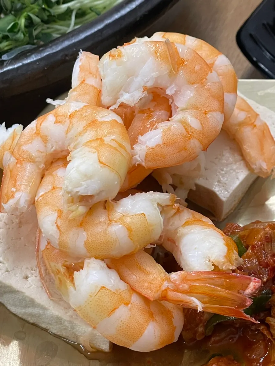 A peeled piece of salt-grilled shrimp