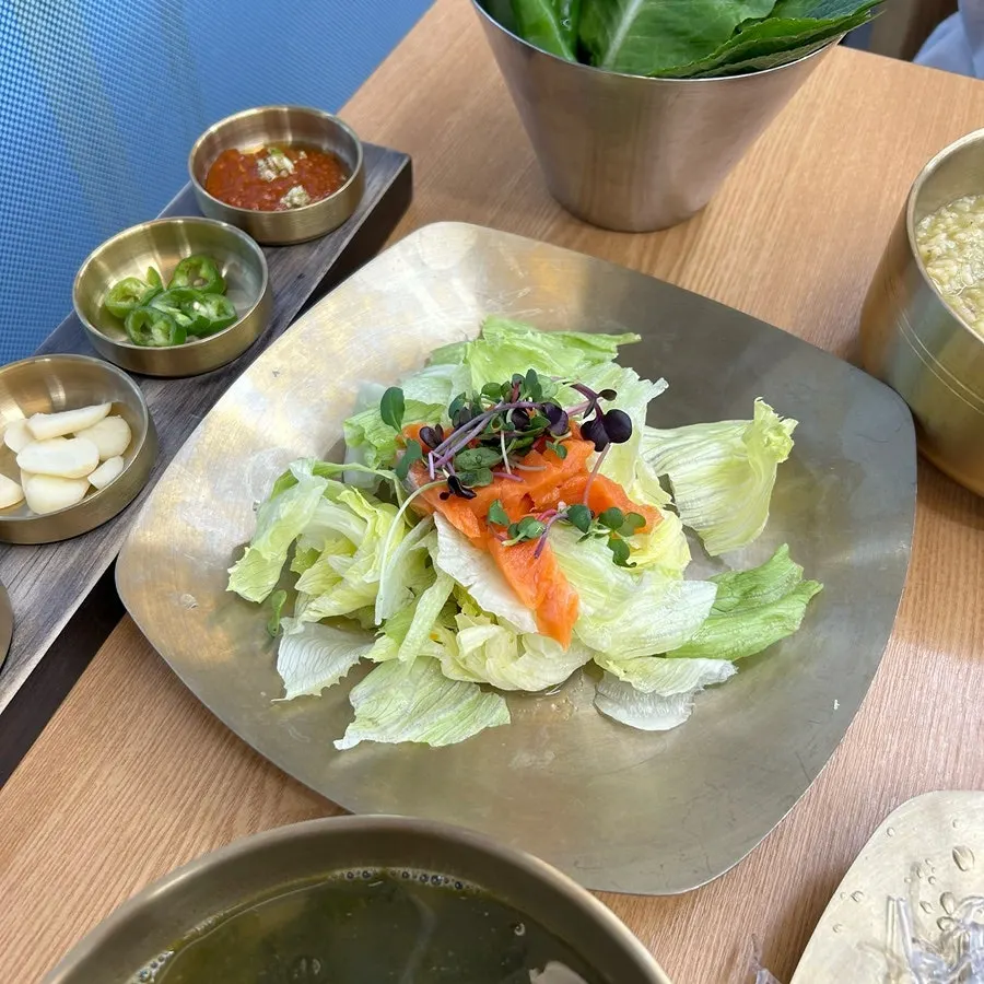 Banchan including corn salad and fried items