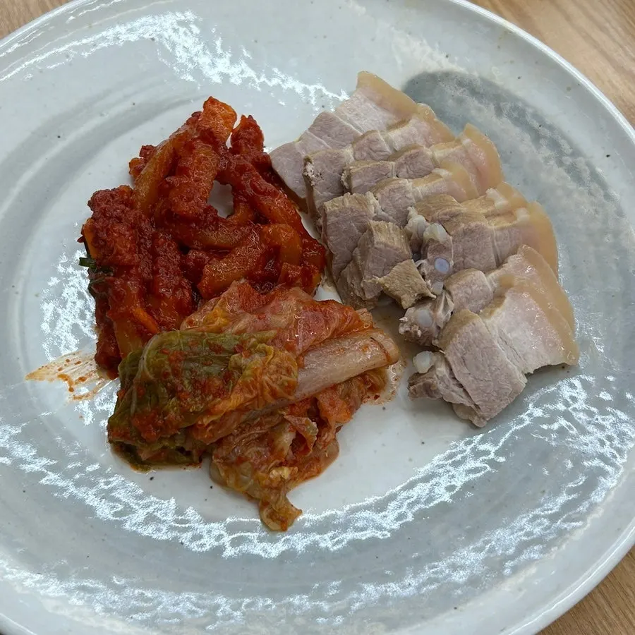 Boiled pork wraps with tangy kimchi