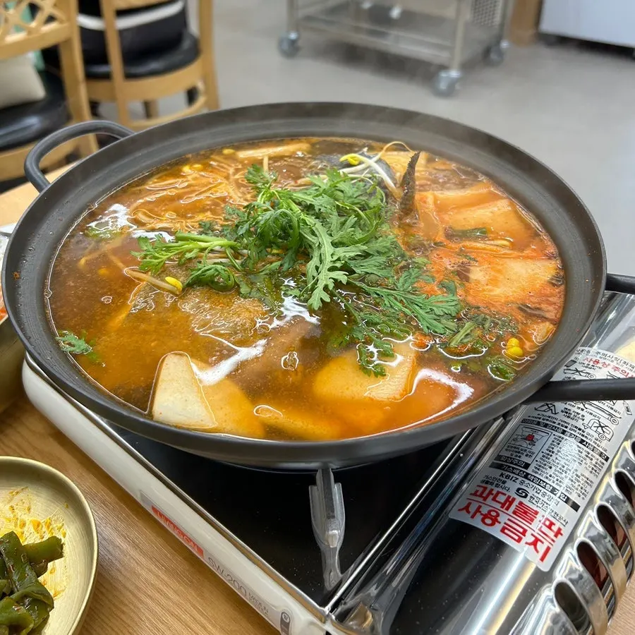 Spicy fish stew finishing the course
