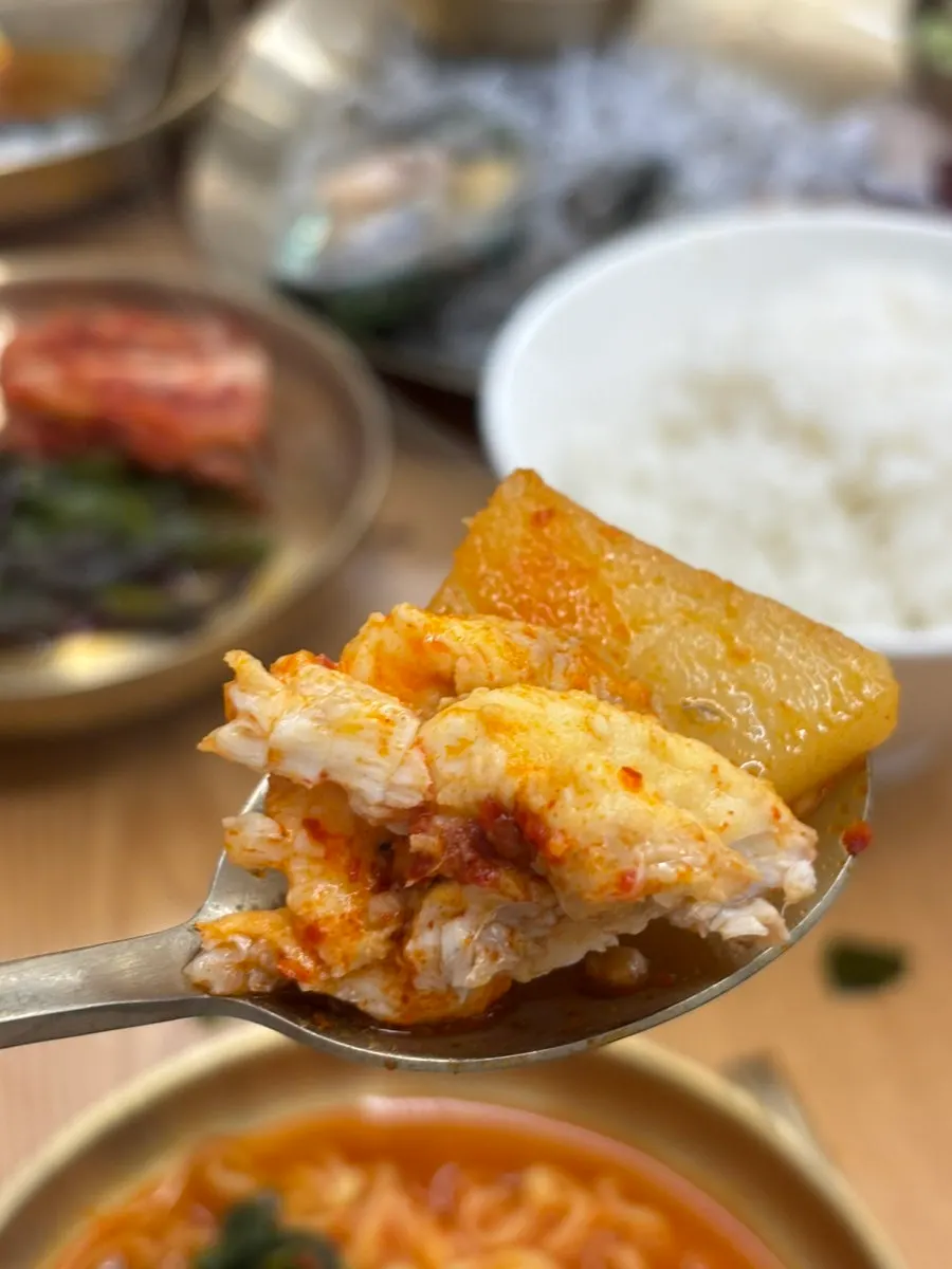 Bowl of spicy fish stew with added ramyeon noodles