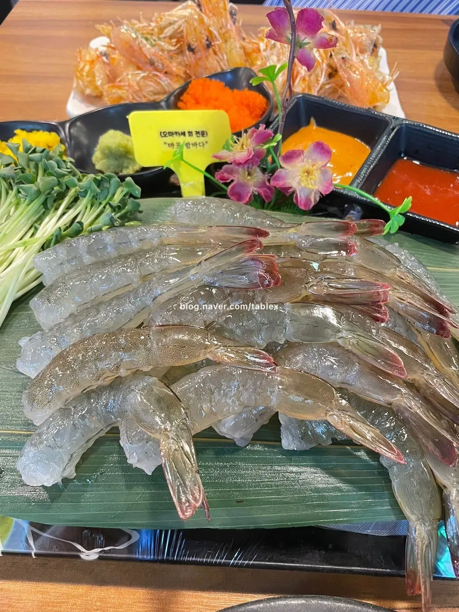 A full spread of raw shrimp sashimi at Mapo Bamdada