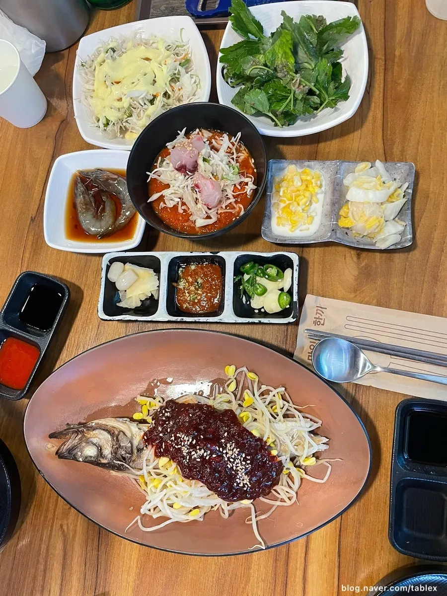 Complimentary side dishes served after ordering raw shrimp sashimi
