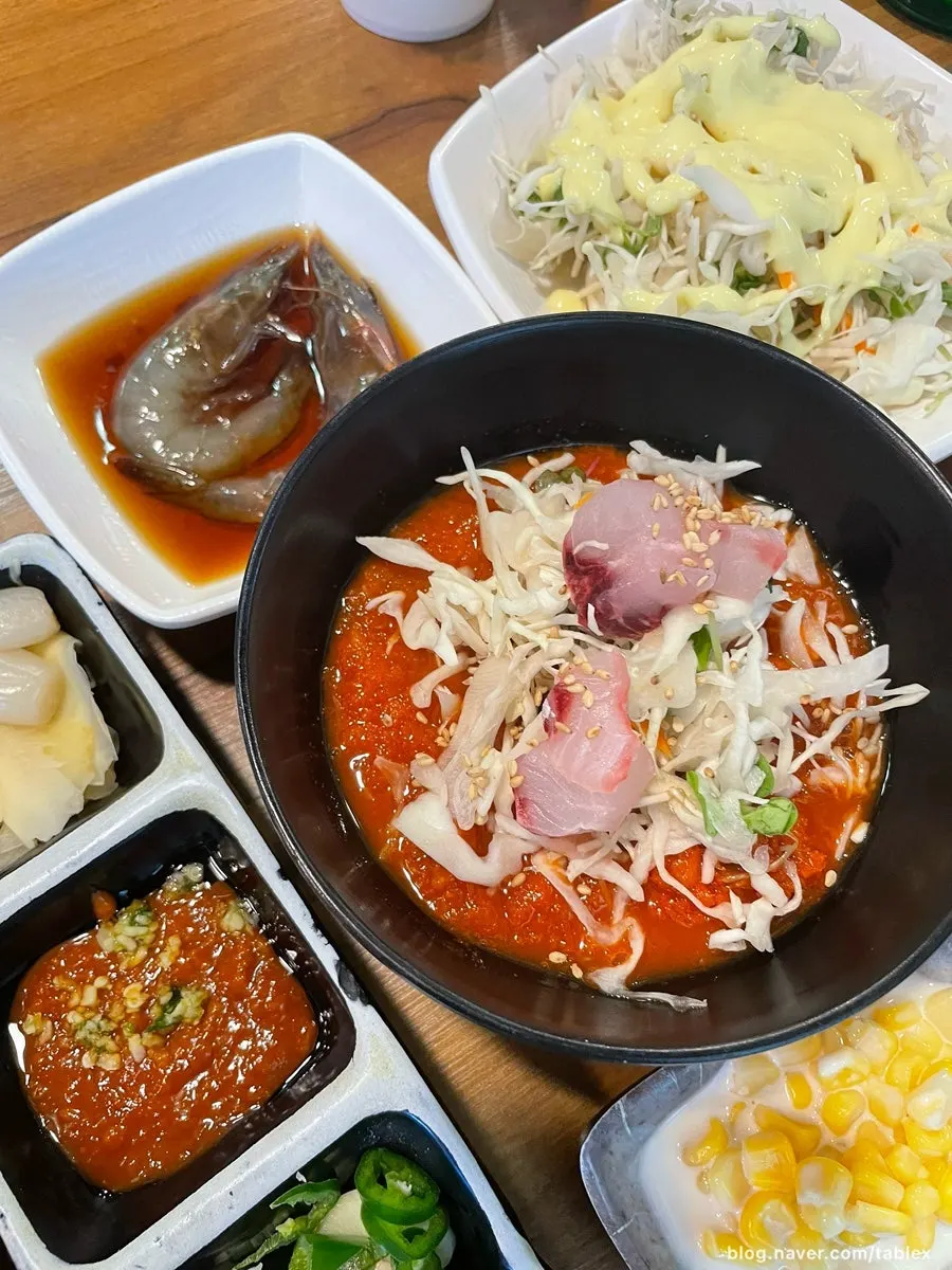Soy sauce shrimp and mulhoe served as side dishes