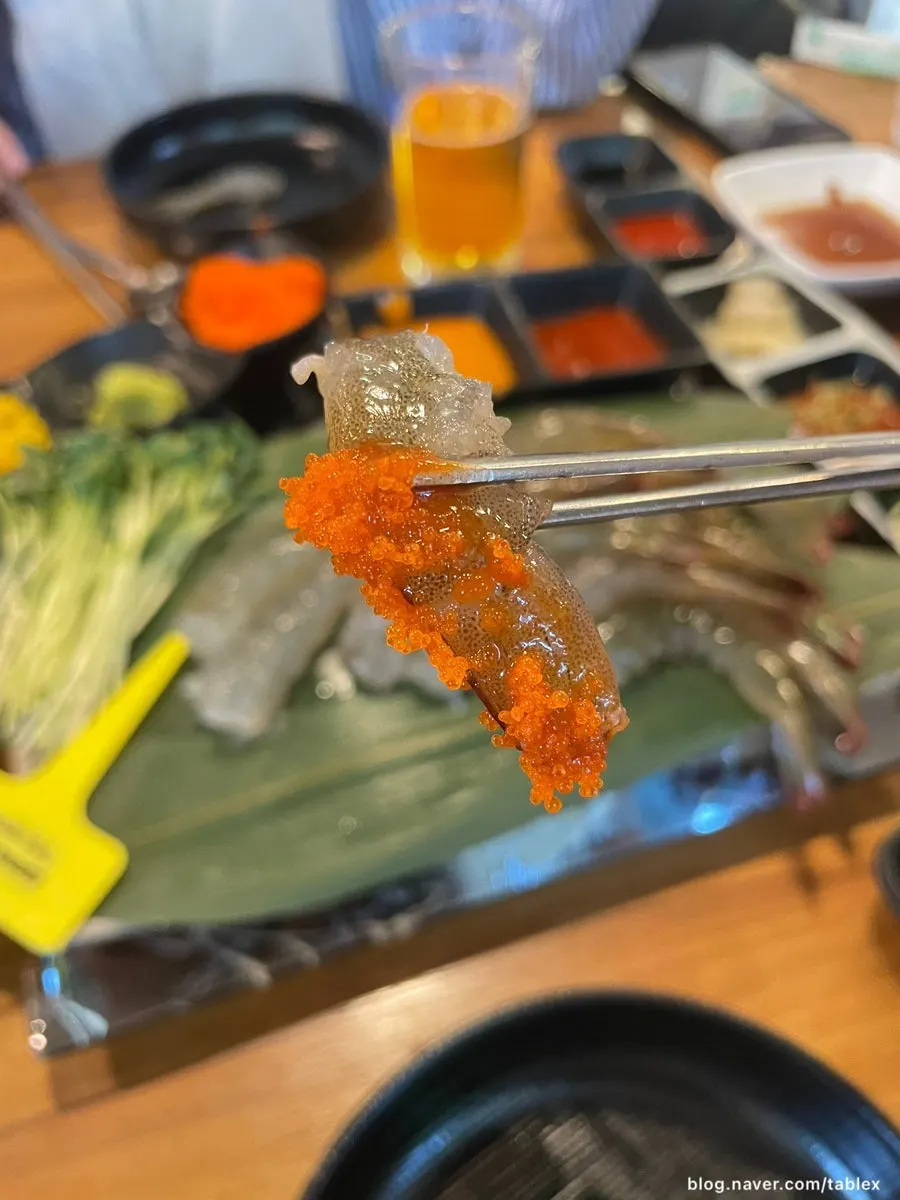 Raw shrimp sashimi wrapped with chamnamul salad and baek-kimchi