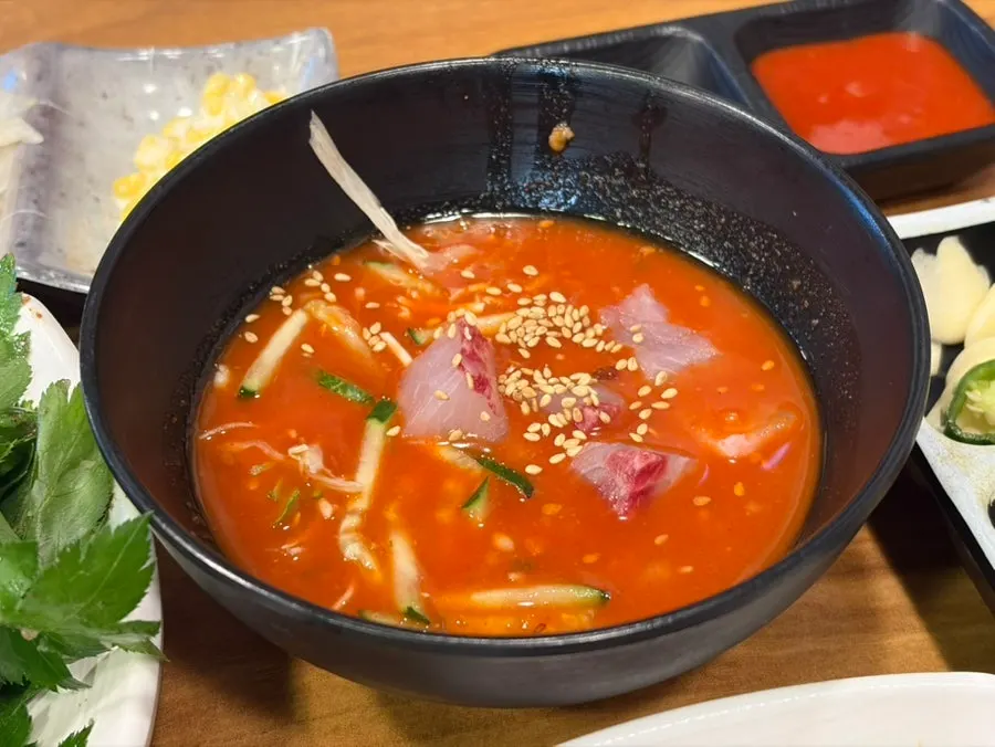 Bowl of mulhoe (cold raw fish soup) served as a basic side