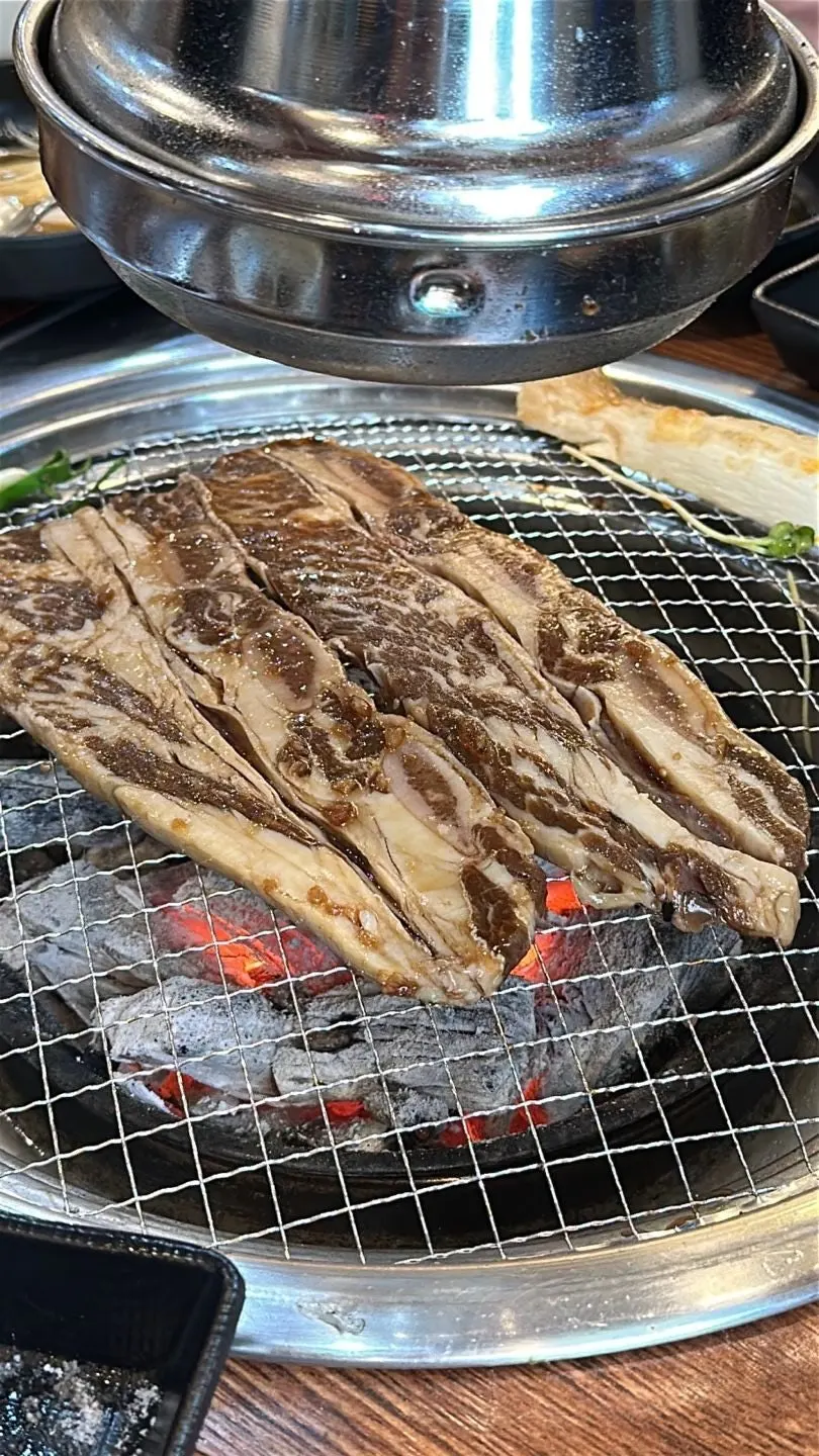 Grilled sogalbisal placed on top of rice