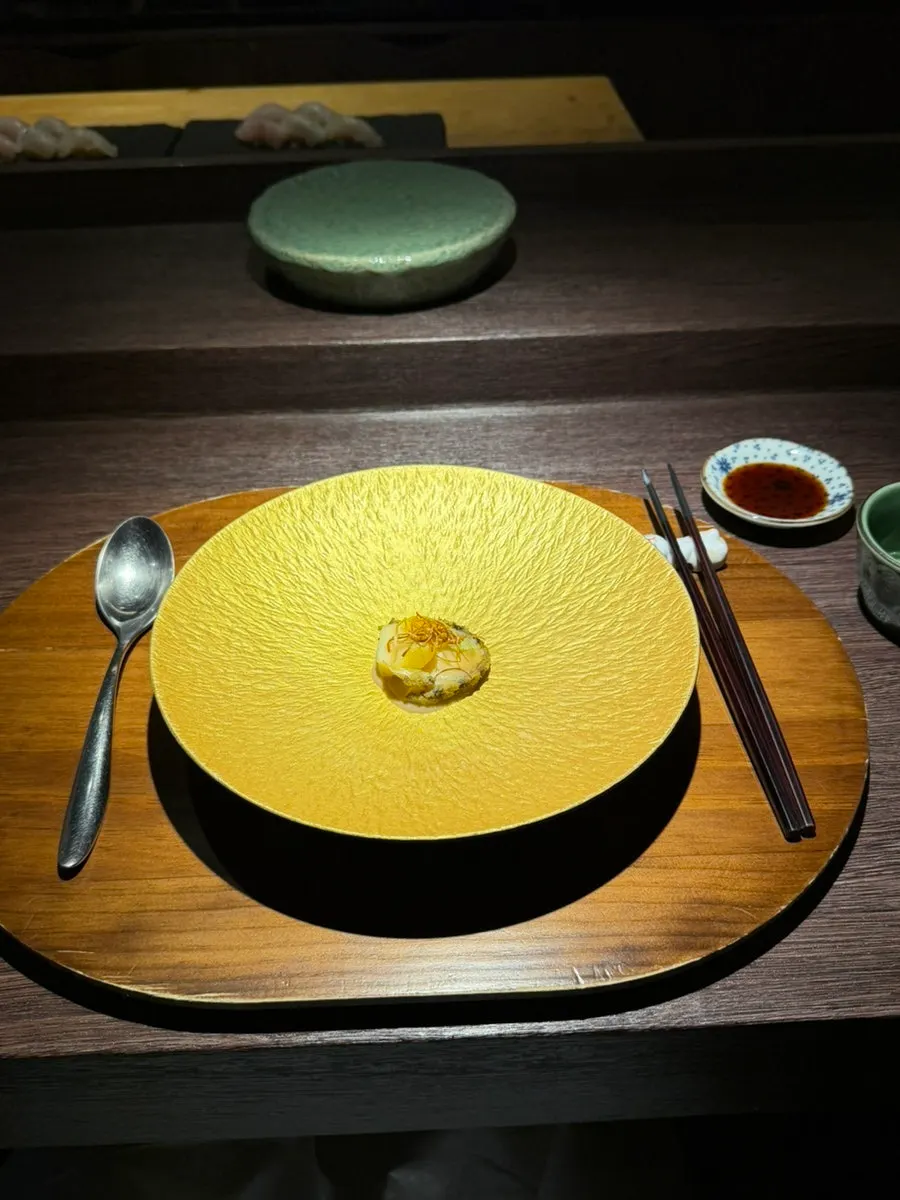 Steamed abalone topped with fried leek strips