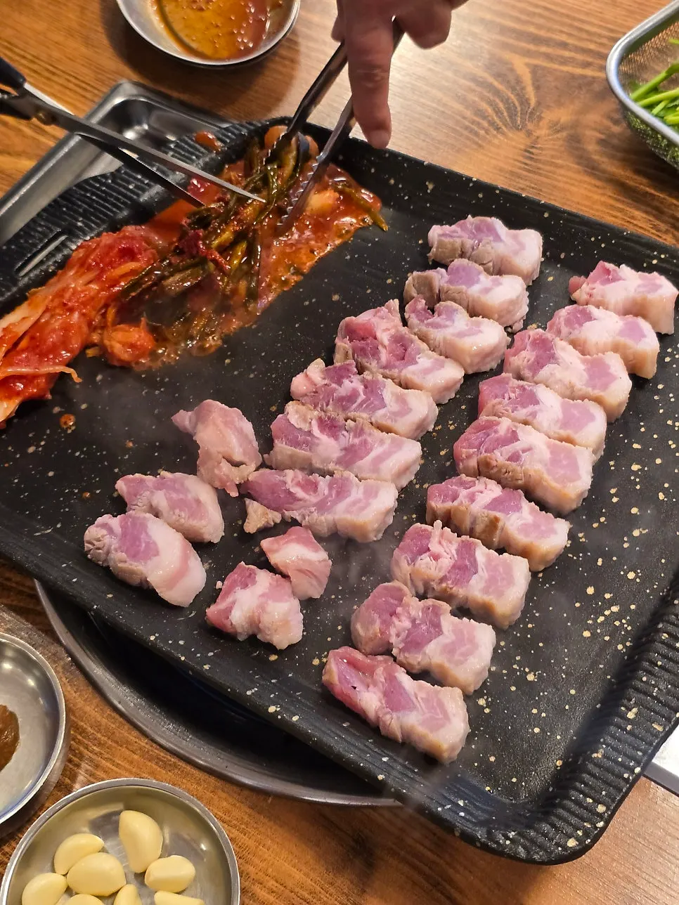 Close-up of pork belly cooking