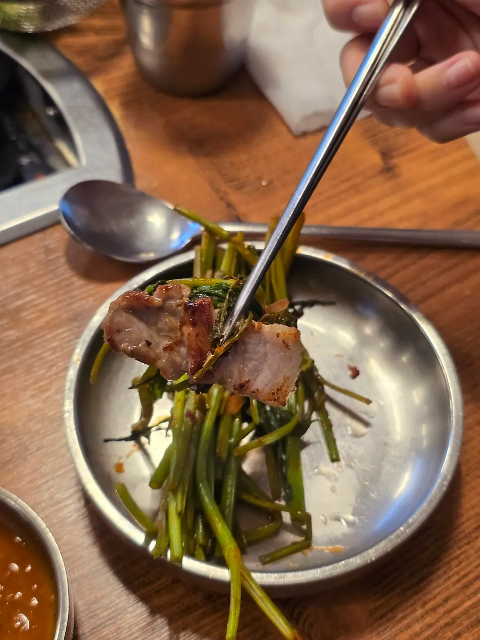 Minari grilled alongside the whole pork belly