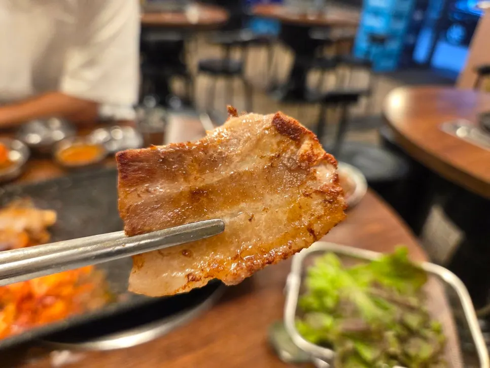 Table setting with frozen pork belly and a bowl of rice