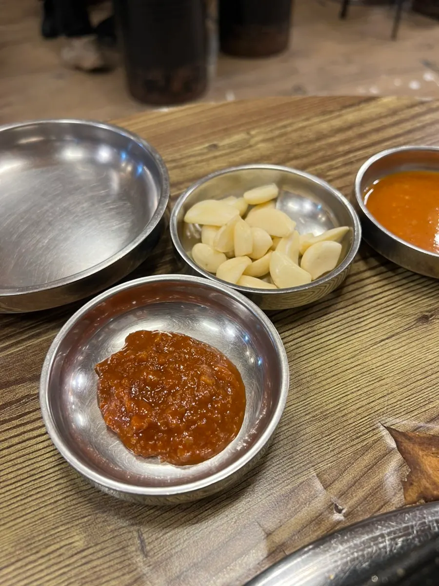 Plate of ssamjang, garlic, and soybean powder sauce
