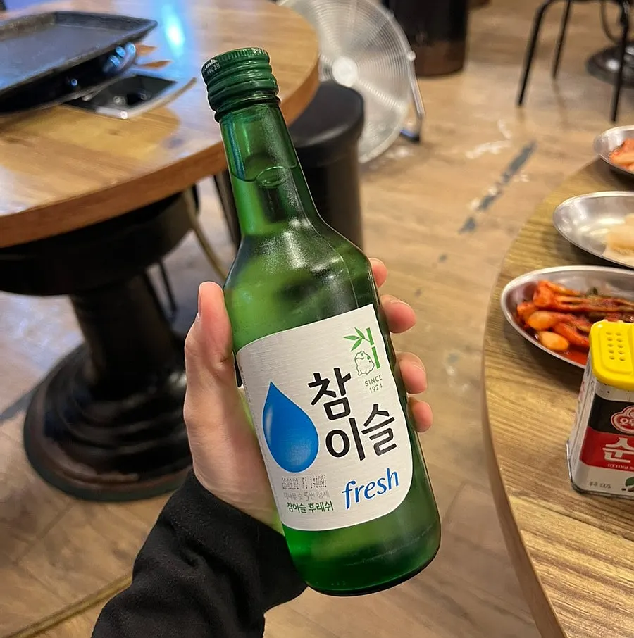 Table with a bottle of water and soju