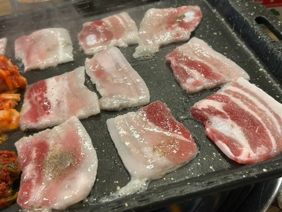 Grilled frozen pork belly sprinkled with black pepper