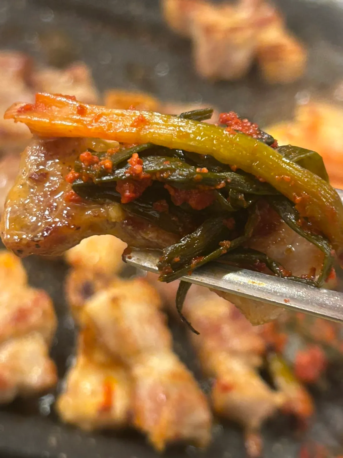 Pork belly topped with green onion kimchi
