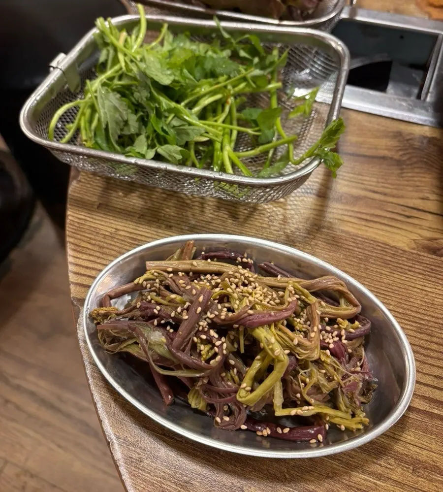 Plate of lettuce and vegetable side dishes