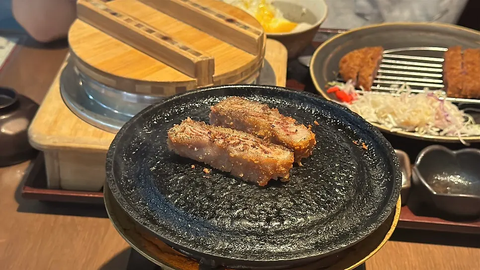 Kettle of refilled broth alongside the gyukatsu spread