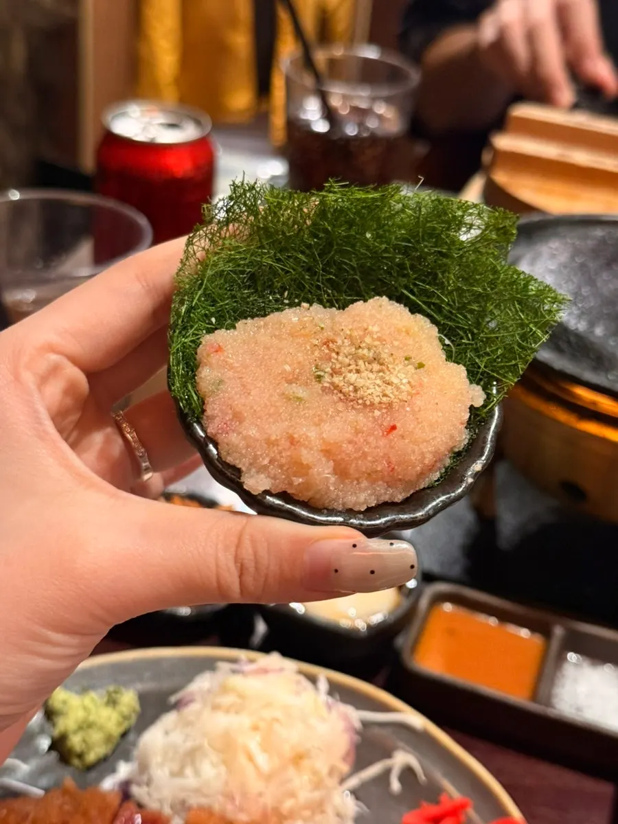 Gyukatsu placed on the grill, ready to cook