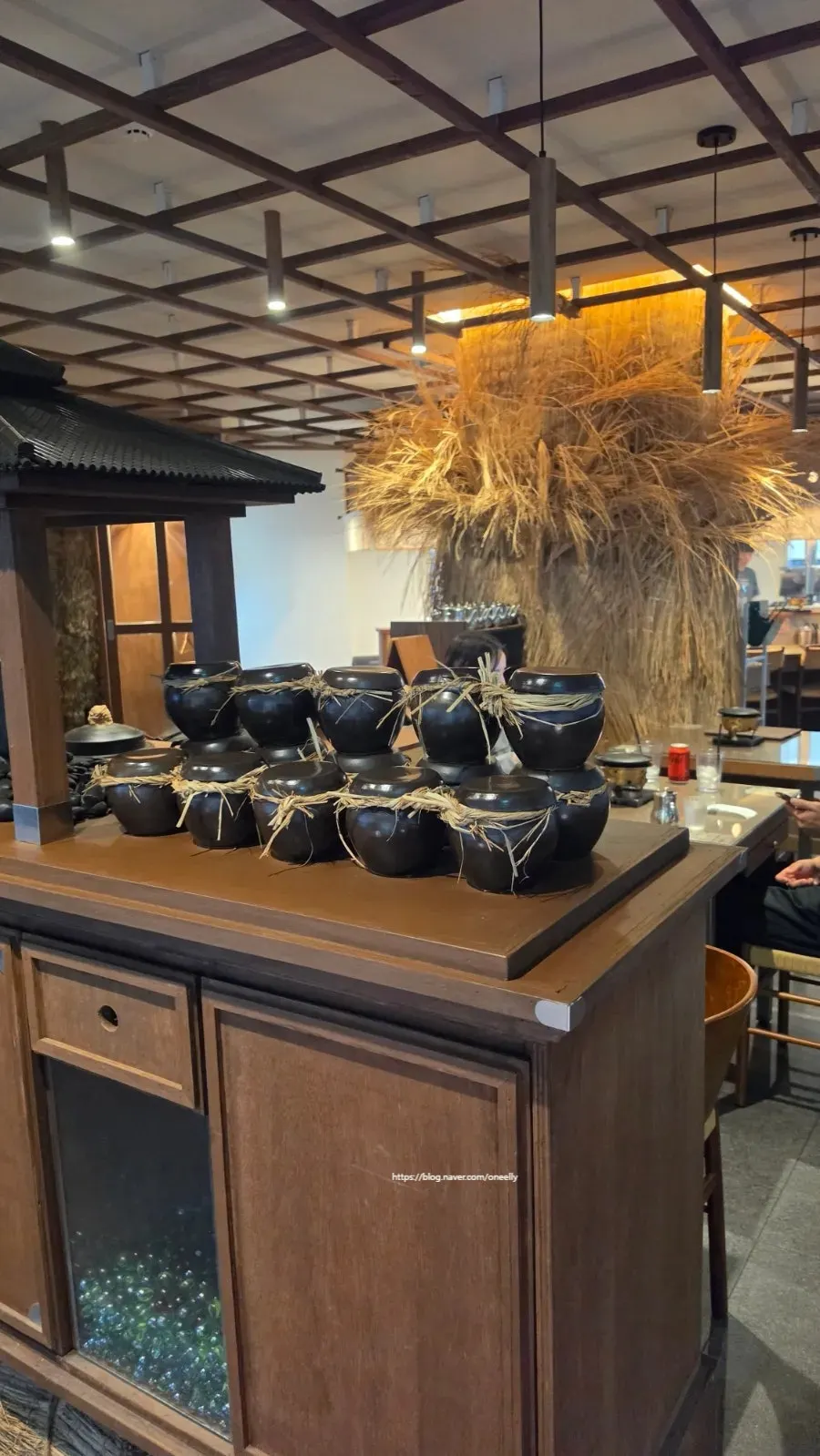 Interior of Gyudo with a gray fox decoration and jars