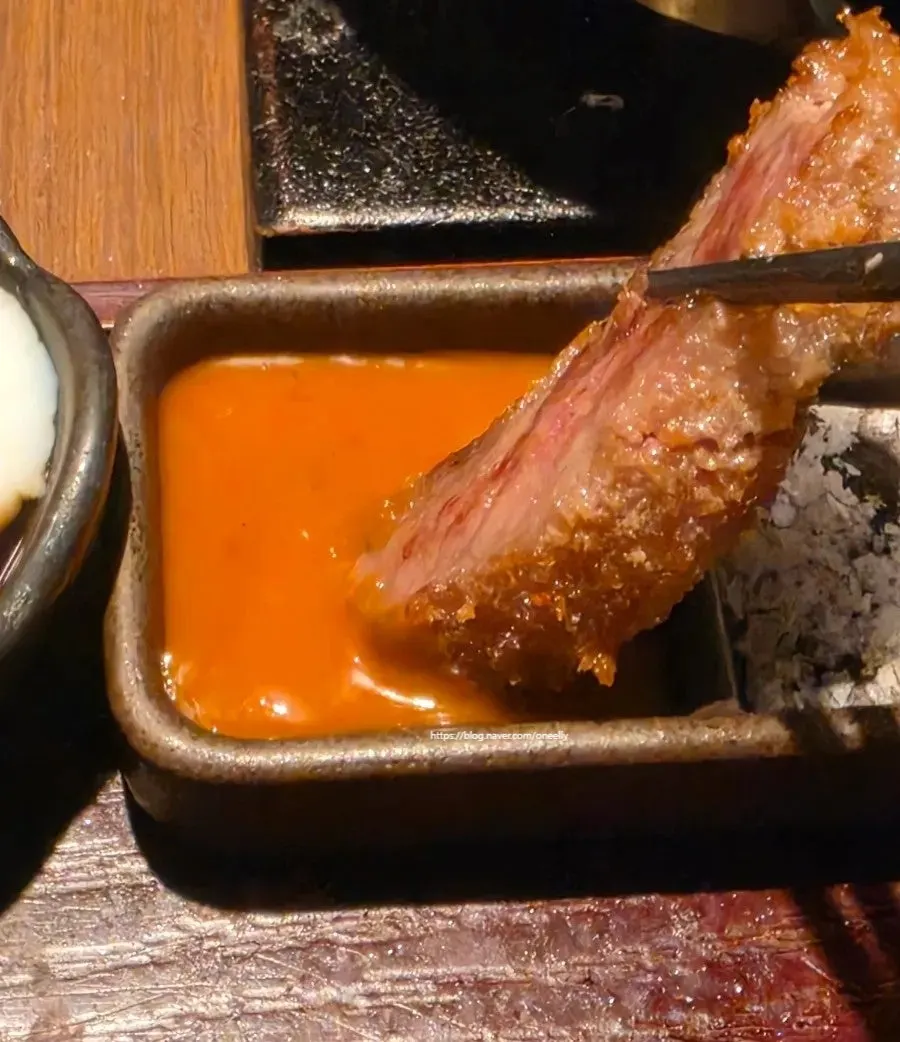 Gyukatsu dipped in brown sauce and salt