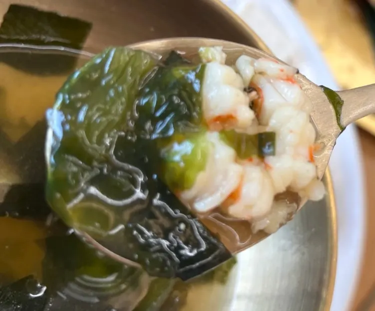 Warm seaweed soup served on the side