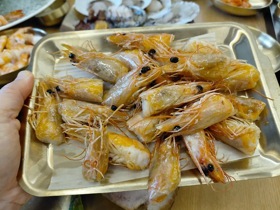 A plate of cut-off shrimp heads