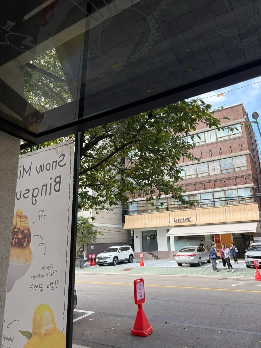 View through the window of the ramen shop across the street