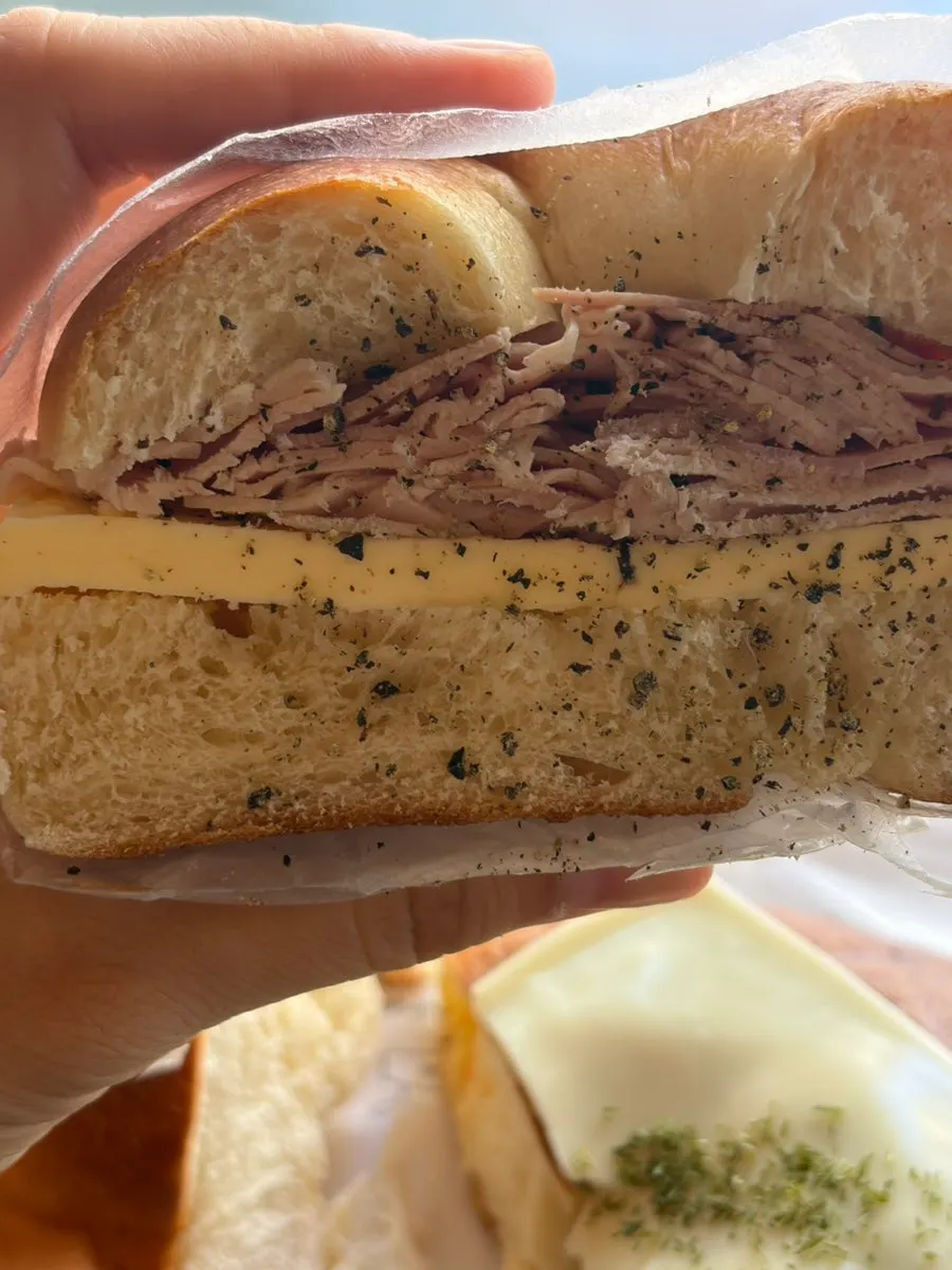 Cross-section of the halved jambon sandwich showing thick butter