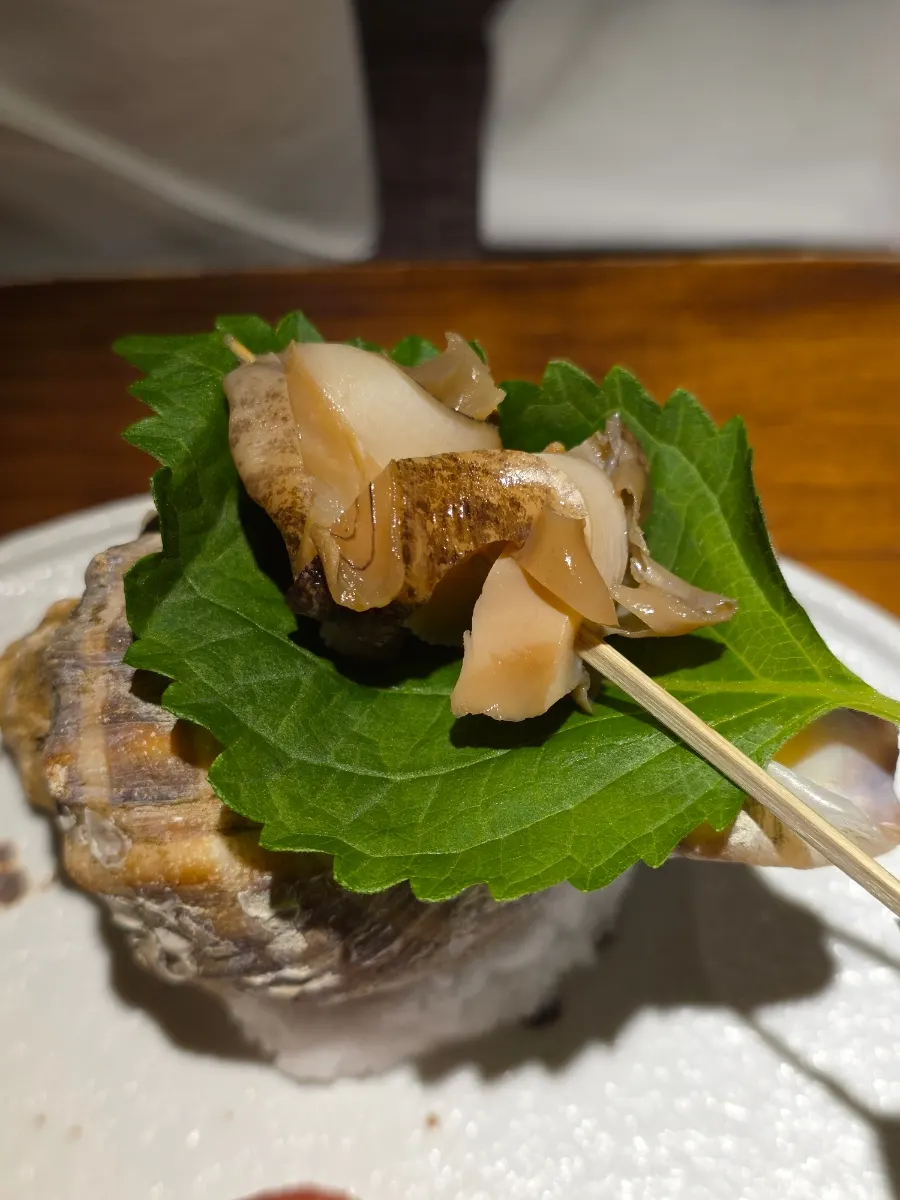 Close-up of braised conch and fig cream cheese appetizers