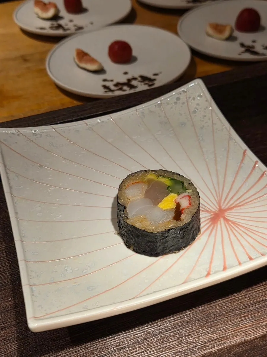 Sushi topped with blanched and chilled snow crab leg